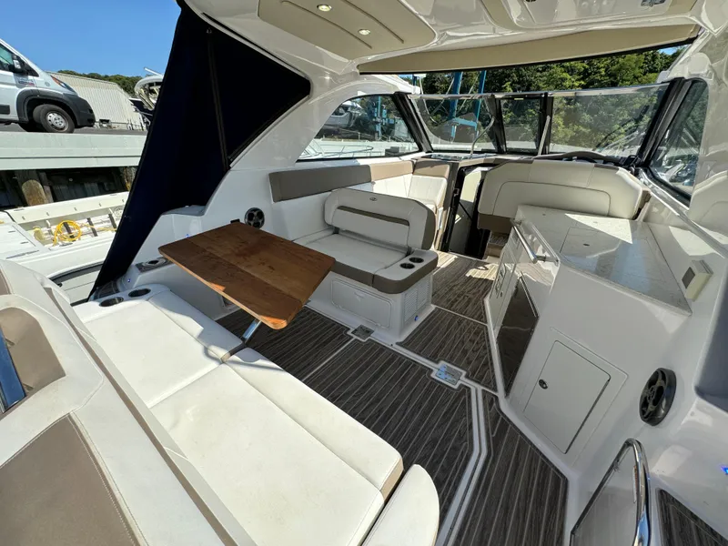 Slide: The Image of 2016 Regal 35 Sport Coupe interior with seating, table, and modern design. - 30