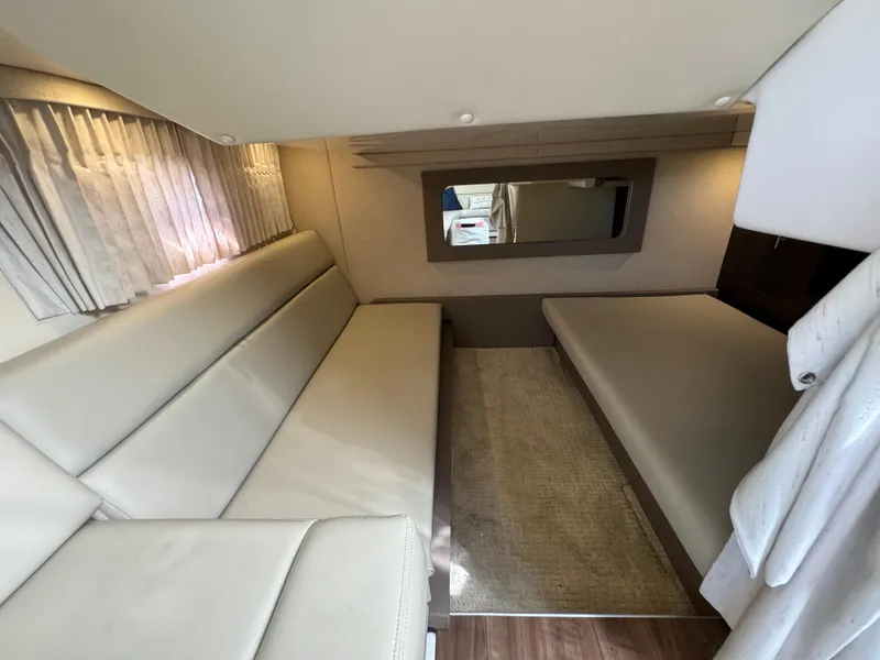 Slide: The Image of Interior of 2016 Regal 35 Sport Coupe with beige seating and modern decor. - 35