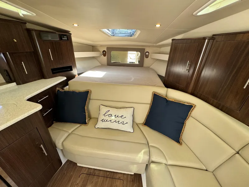 Slide: The Image of Luxurious interior of 2016 Regal 35 Sport Coupe with plush seating and elegant cabinetry. - 37