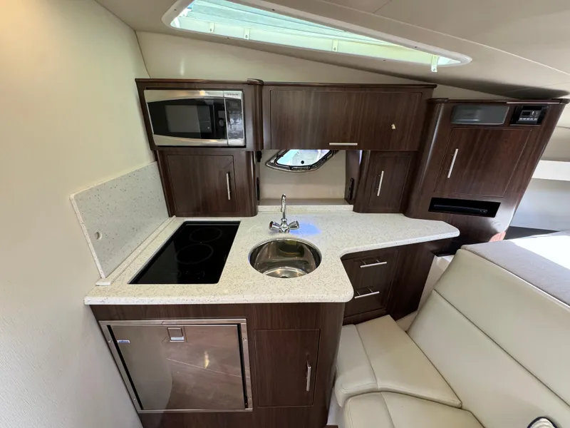 Slide: The Image of 2016 Regal 35 Sport Coupe kitchen with modern appliances and sleek cabinetry. - 40