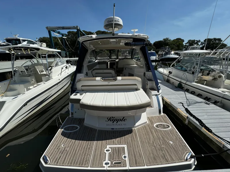 Slide: The Image of 2016 Regal 35 Sport Coupe yacht docked at marina, rear view. - 9