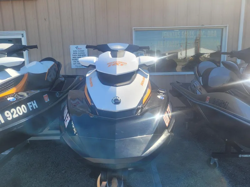Slide: The Image of 2012 Sea-Doo RXT 260 jet ski parked outside a building. - 1