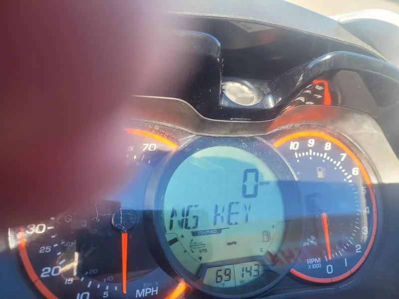 Slide: The Image of Close-up of 2012 Sea-Doo RXT 260 dashboard with digital display and gauges. - 4