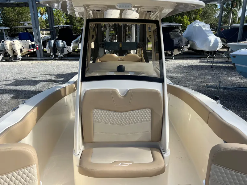 Slide: The Image of 2025 Scout 277 LXF boat interior with beige seating and sleek design. - 20