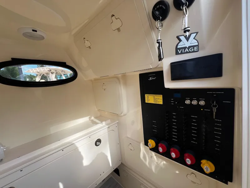 Slide: The Image of 2025 Scout 277 LXF interior with control panel and storage compartments. - 22