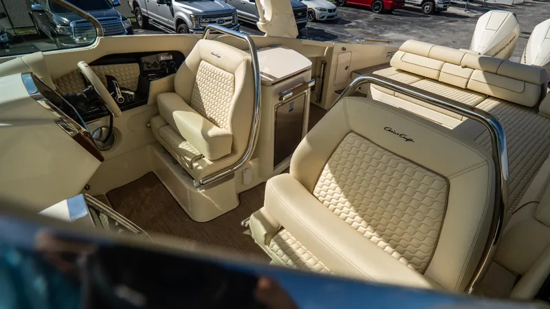 Slide: The Image of Luxurious interior of 2025 Chris-Craft Launch 31 GT boat with beige leather seating. - 13