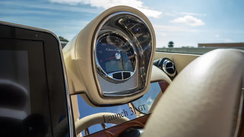 Slide: The Image of 2025 Chris-Craft Launch 31 GT dashboard with elegant design and modern instrumentation. - 17