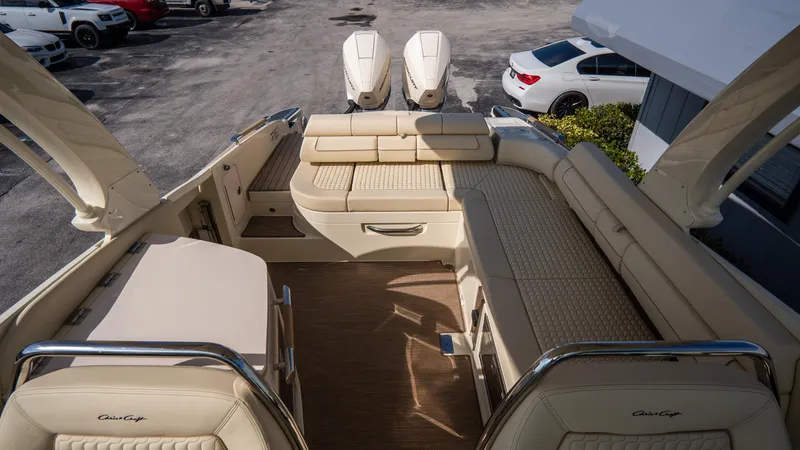 Slide: The Image of 2025 Chris-Craft Launch 31 GT boat interior with luxurious seating and twin engines. - 22