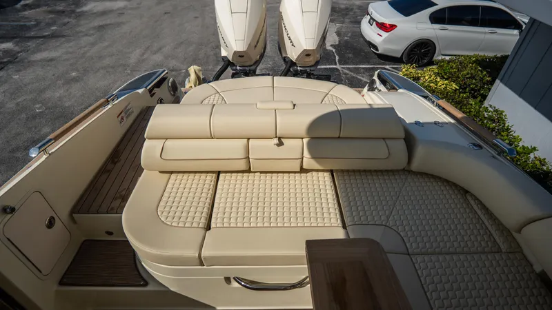 Slide: The Image of 2025 Chris-Craft Launch 31 GT boat with luxurious beige seating and dual engines. - 29