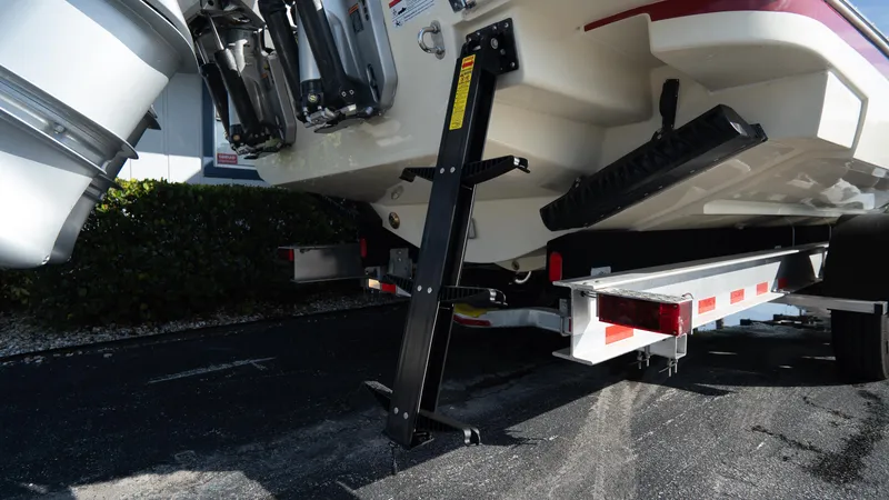 Slide: The Image of 2025 Chris-Craft Launch 31 GT boat on trailer, rear view with outboard motors. - 3