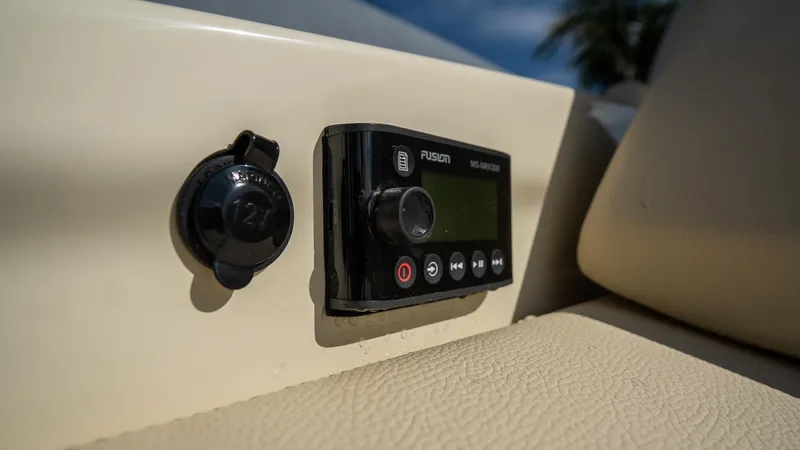 Slide: The Image of Control panel on 2025 Chris-Craft Launch 31 GT boat, featuring Fusion audio system. - 31