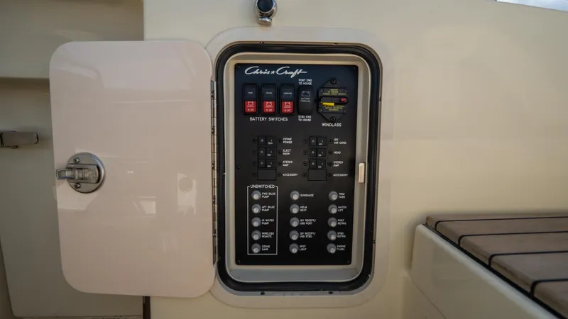 Slide: The Image of 2025 Chris-Craft Launch 31 GT control panel with switches and indicators. - 34