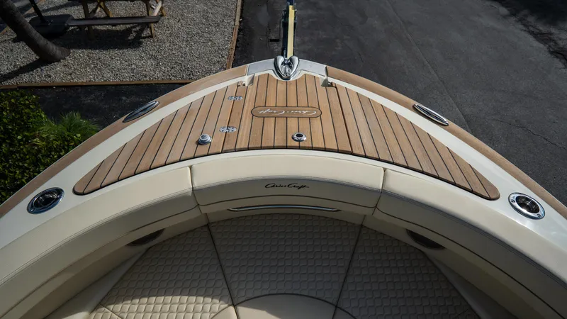 Slide: The Image of 2025 Chris-Craft Launch 31 GT boat with elegant wooden deck and luxurious seating. - 6