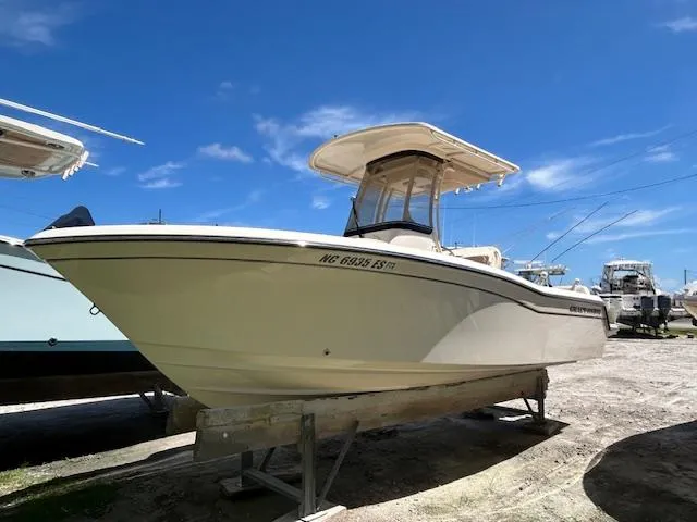 The Image of 2021 Grady-White Fisherman 216 boat on display under a clear blue sky. - 0