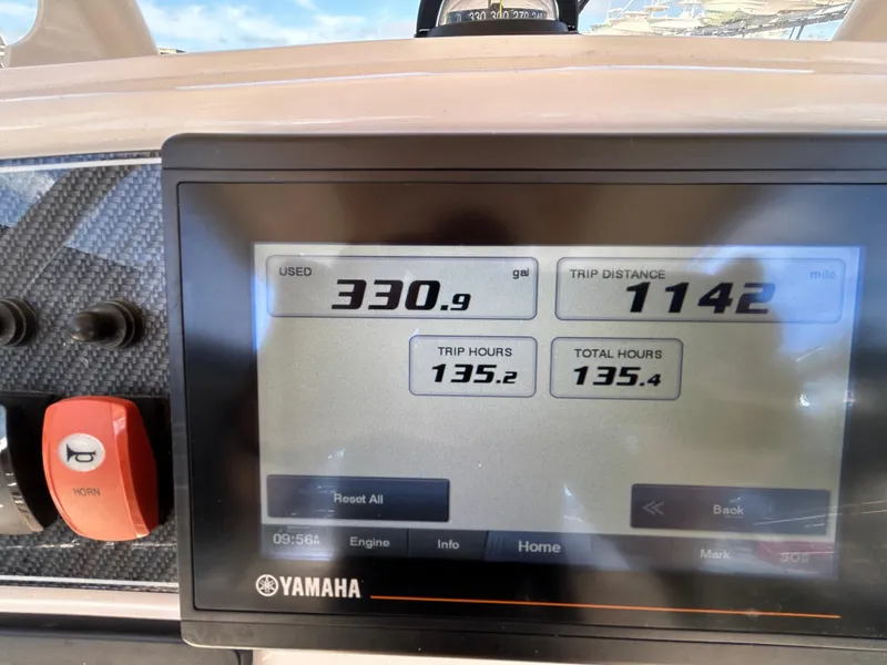 Slide: The Image of Yamaha boat display showing fuel usage, trip distance, and engine hours. Grady-White Fisherman 216, 2021. - 13