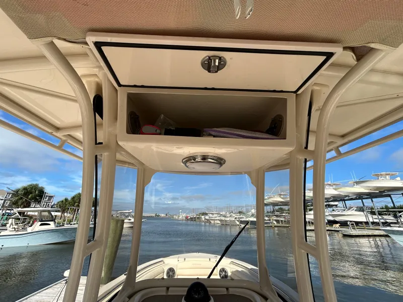 Slide: The Image of 2021 Grady-White Fisherman 216 boat console with storage, docked at marina. - 17
