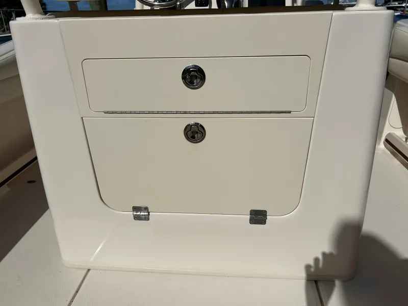Slide: The Image of 2021 Grady-White Fisherman 216 boat storage compartment with secure locks. - 20