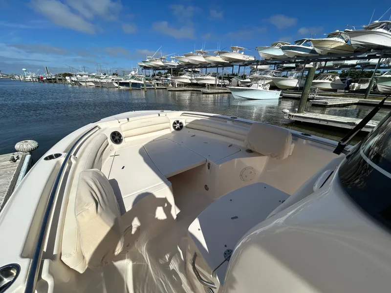 Slide: The Image of 2021 Grady-White Fisherman 216 boat docked at marina with clear blue sky. - 23