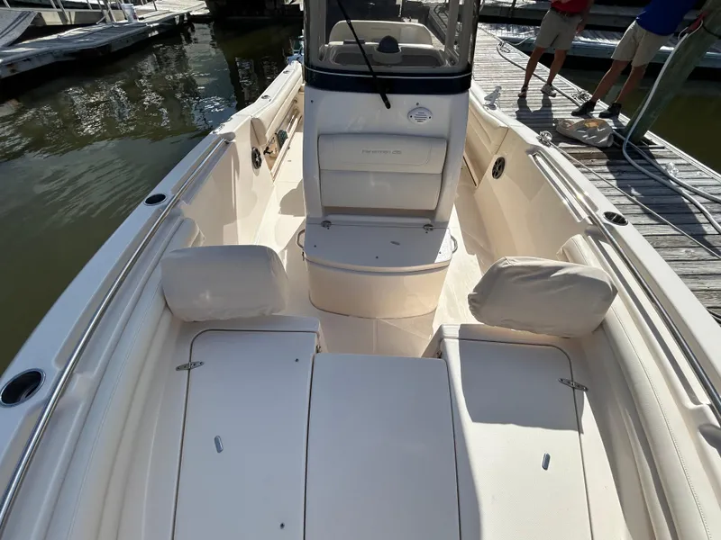 Slide: The Image of 2021 Grady-White Fisherman 216 boat interior with seating and console, docked at marina. - 24