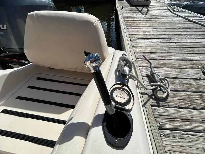 Slide: The Image of 2021 Grady-White Fisherman 216 boat interior with rod holder and docked rope. - 7