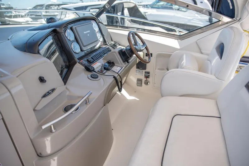 Slide: The Image of 2008 Sea Ray 380 Sundancer helm with modern controls and comfortable seating. - 4