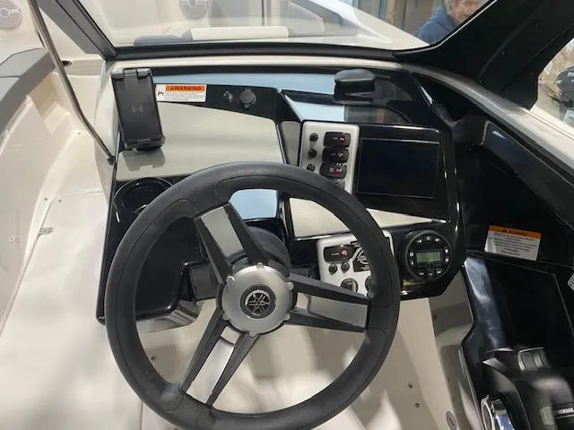 Slide: The Image of 2025 Yamaha Boats AR220 dashboard with steering wheel and control panel. - 4