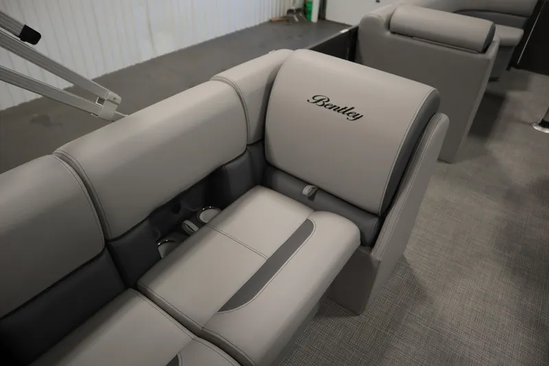 Slide: The Image of 2025 Bentley Pontoons 243 Cruise XL Tri-Toon interior with gray seating and table. - 13