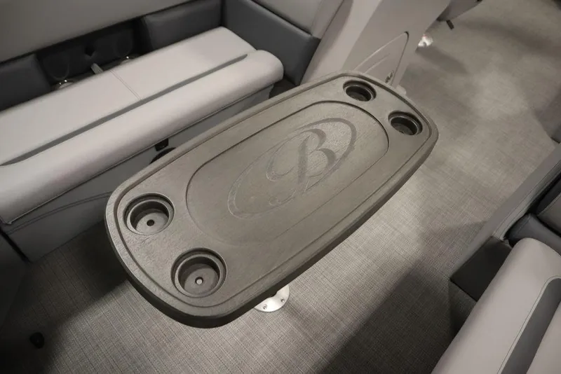 Slide: The Image of 2025 Bentley Pontoons 243 Cruise XL Tri-Toon interior with table and cup holders. - 20
