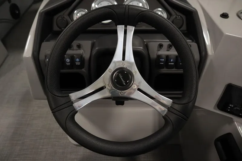 Slide: The Image of Steering wheel of 2025 Bentley Pontoons 243 Cruise XL Tri-Toon boat. - 23