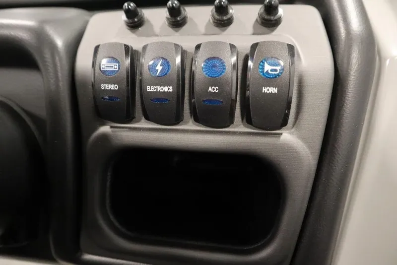 Slide: The Image of Control panel of 2025 Bentley Pontoons 243 Cruise XL Tri-Toon with labeled switches. - 26