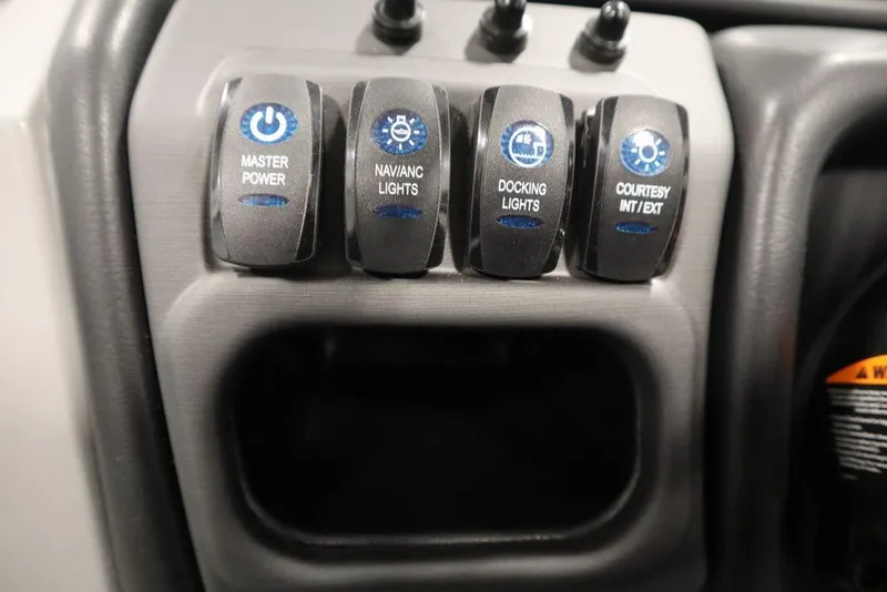 Slide: The Image of Control panel of 2025 Bentley Pontoons 243 Cruise XL Tri-Toon with labeled switches. - 27