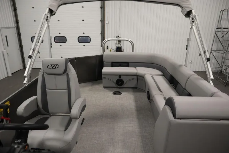 Slide: The Image of 2025 Bentley Pontoons 243 Cruise XL Tri-Toon interior with gray seating and helm. - 31