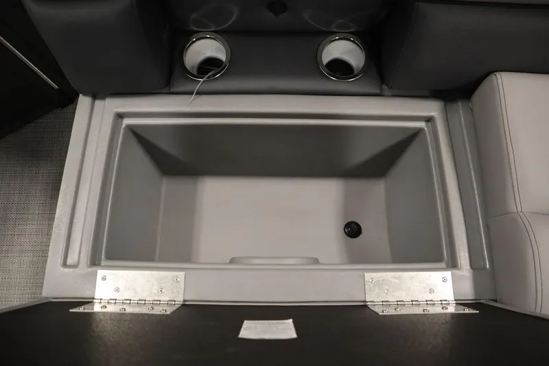 Slide: The Image of 2025 Bentley Pontoons 243 Cruise XL Tri-Toon storage compartment with cup holders. - 43
