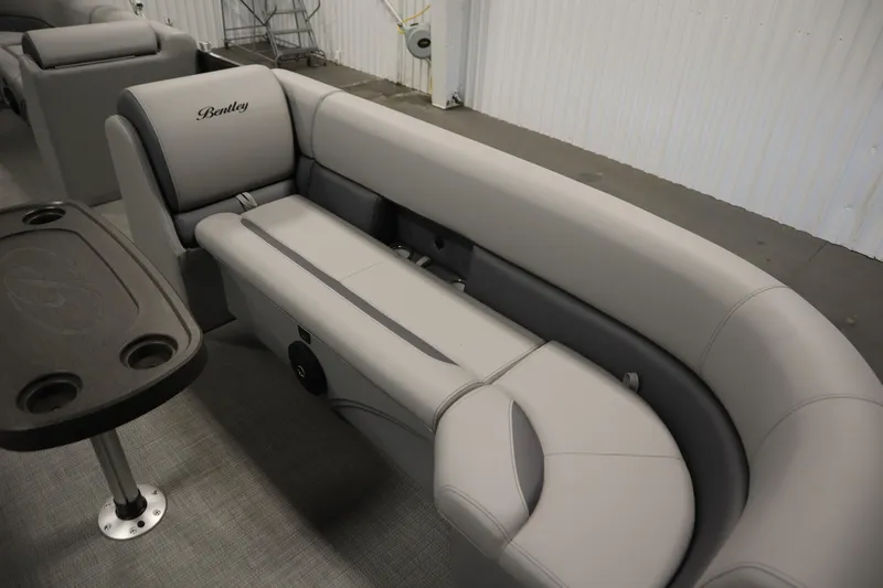Slide: The Image of 2025 Bentley Pontoons 243 Cruise XL Tri-Toon in a spacious indoor setting. - 7