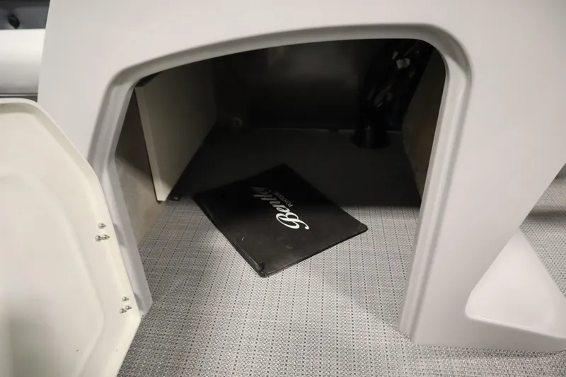 Slide: The Image of 2025 Bentley Pontoons 243 Cruise XL Tri-Toon in a warehouse setting. - 9