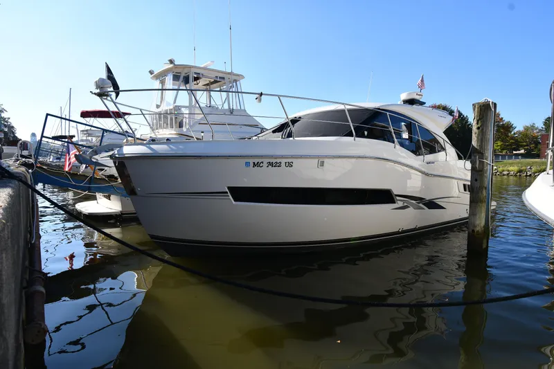Slide: The Image of 2017 Carver C37 Coupe yacht docked in marina, sunny day. - 3