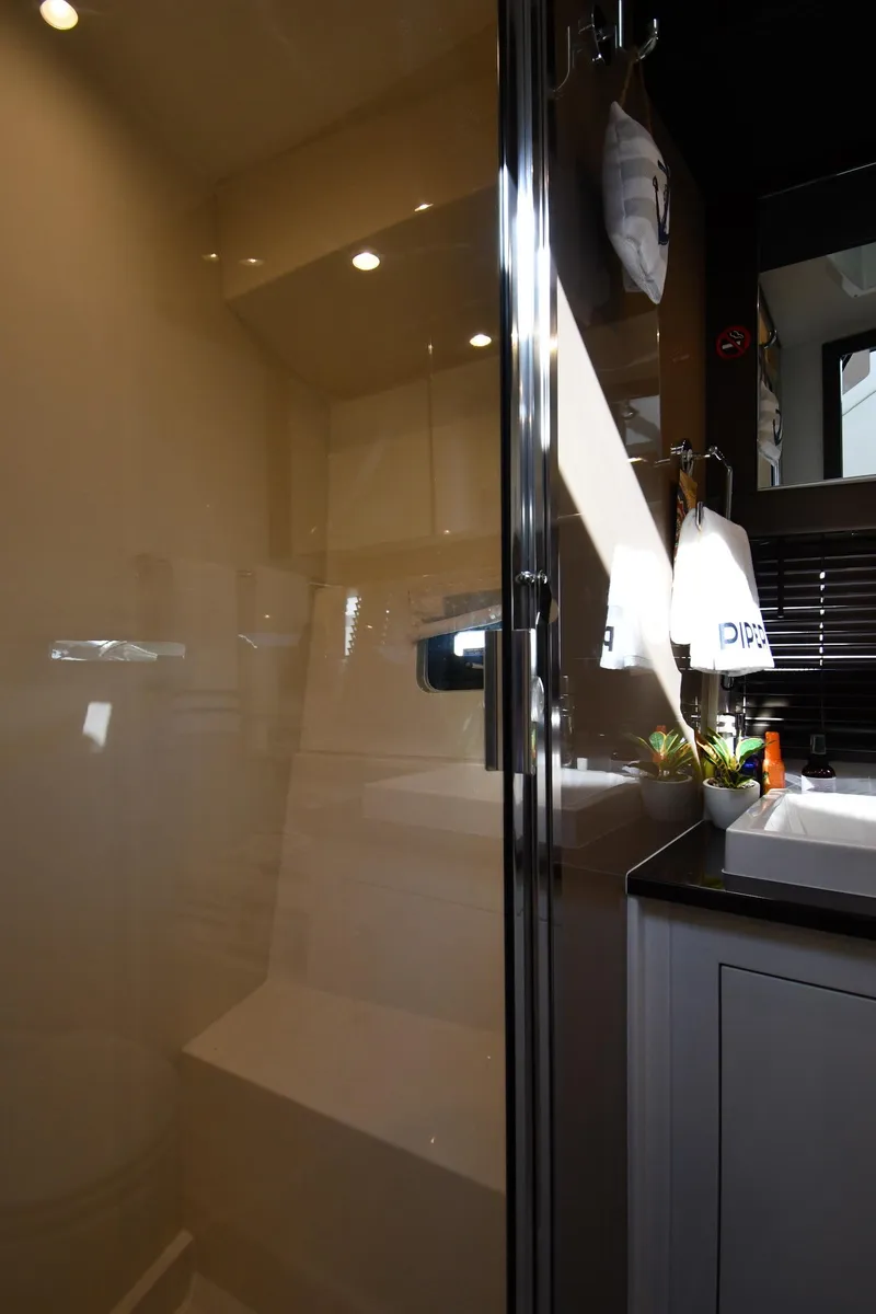 Slide: The Image of Interior of 2017 Carver C37 Coupe bathroom with modern fixtures and lighting. - 34