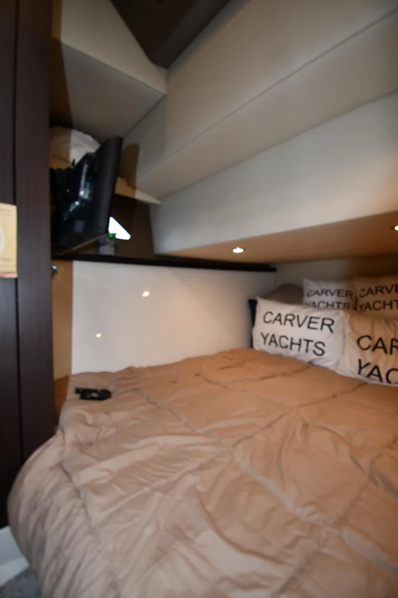 Slide: The Image of Cozy interior cabin of 2017 Carver C37 Coupe yacht with plush bedding. - 38