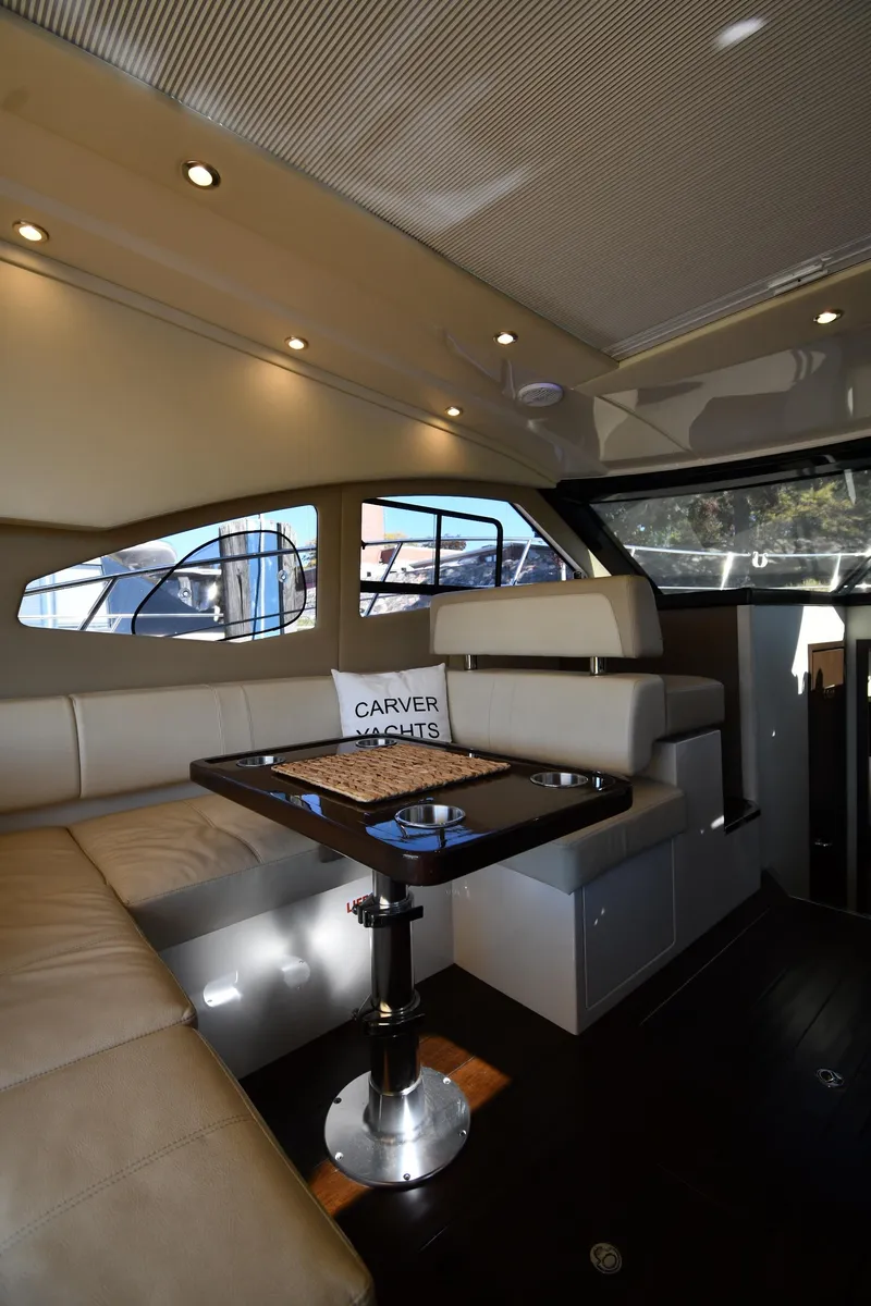 Slide: The Image of Interior of 2017 Carver C37 Coupe yacht with elegant seating and table. - 44
