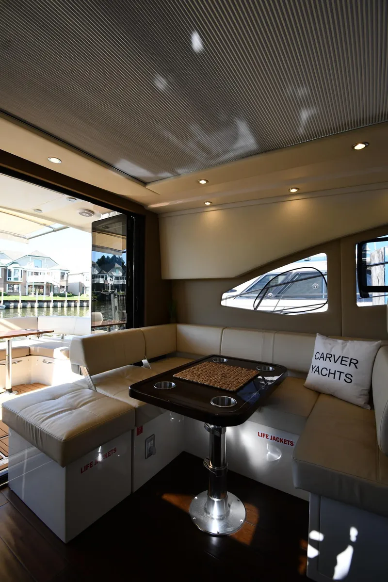 Slide: The Image of Luxurious interior of 2017 Carver C37 Coupe yacht with elegant seating and table. - 46