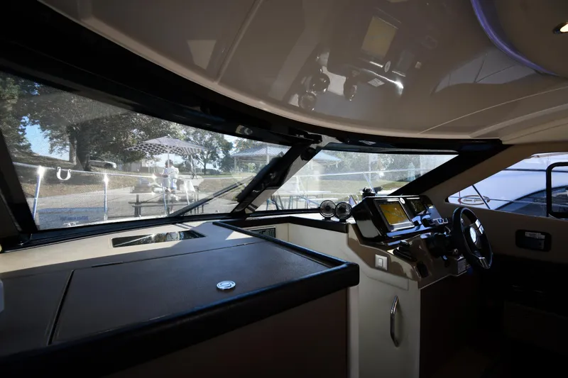 Slide: The Image of Interior view of 2017 Carver C37 Coupe yacht cockpit with modern navigation equipment. - 49