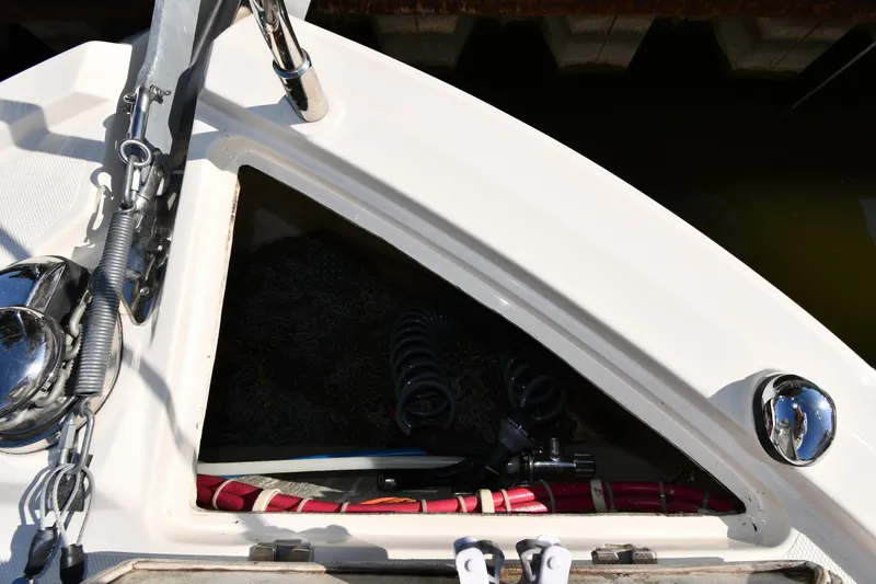 Slide: The Image of Carver C37 Coupe 2017 boat deck with storage compartment and nautical equipment. - 7