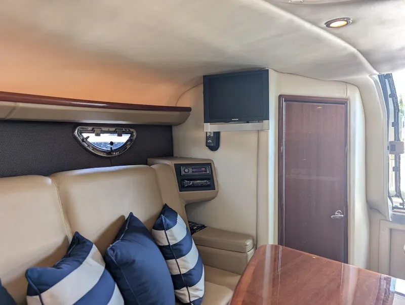 Slide: The Image of Luxurious interior of 2007 Cobalt 323 boat with plush seating and TV. - 15