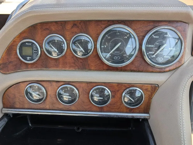 Slide: The Image of Dashboard of 2007 Cobalt 323 with wood paneling and analog gauges. - 19