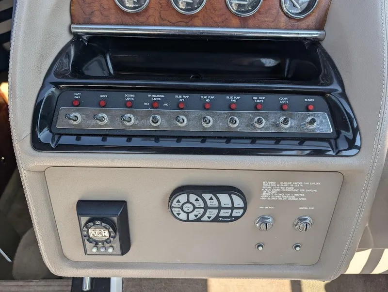 Slide: The Image of Control panel of a 2007 Cobalt 323 boat with switches and dials. - 21