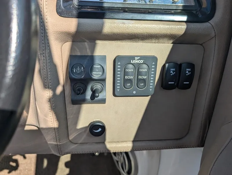 Slide: The Image of 2007 Cobalt 323 boat control panel with Lenco trim tab switches. - 22