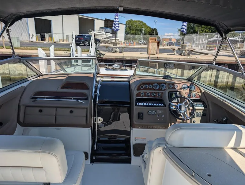 Slide: The Image of Interior of a 2007 Cobalt 323 boat with steering wheel and dashboard controls. - 30