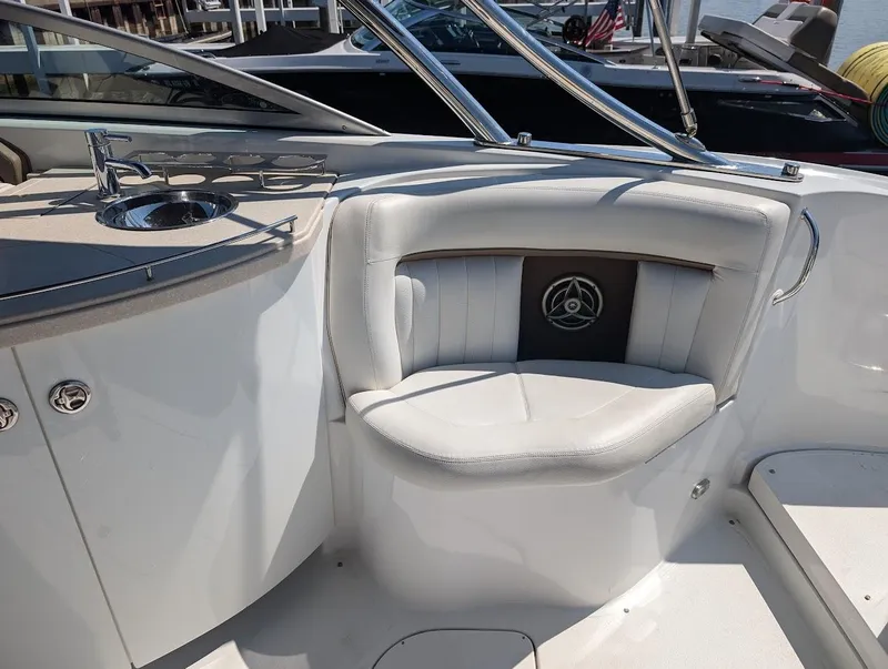 Slide: The Image of 2007 Cobalt 323 boat interior with white seating and stainless steel accents. - 32