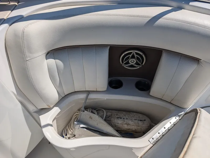 Slide: The Image of 2007 Cobalt 323 boat interior with storage compartment and speaker. - 33