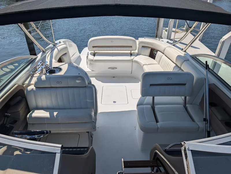 Slide: The Image of 2007 Cobalt 323 boat interior with white leather seating and open deck layout. - 37